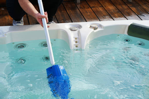 istock Hotel staff worker cleaning the pool 1044171192
