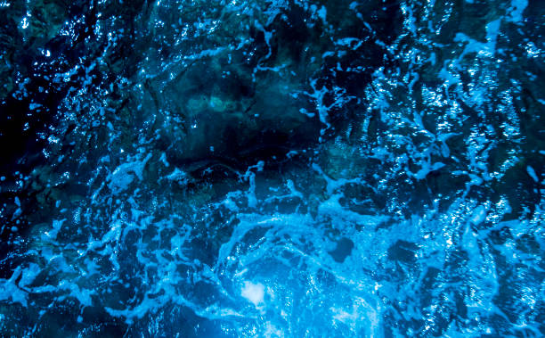 istock Blue deep sea foaming water background 1044171600