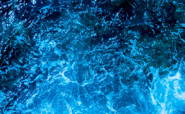 istock Blue deep sea foaming water background 1044172204