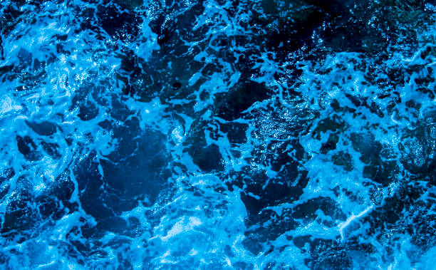 istock Blue deep sea foaming water background 1044172388