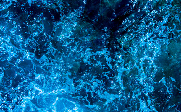 istock Blue deep sea foaming water background 1044172654