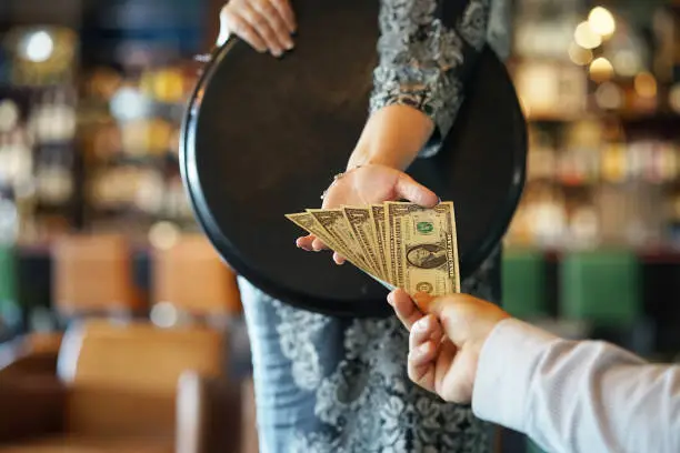 Photo of Girl of the waitress gets a tip