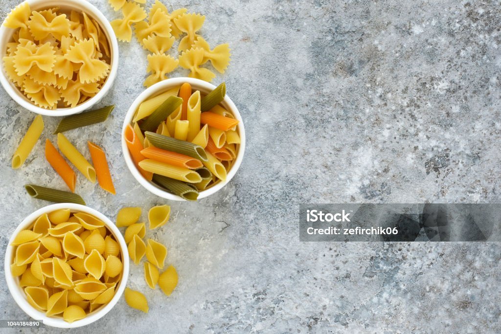 Variation of the paste in the bowls on a concrete background. Animal Shell Stock Photo