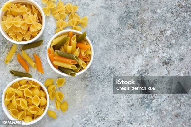 Variation Of The Paste In The Bowls On A Concrete Background Stock Photo - Download Image Now