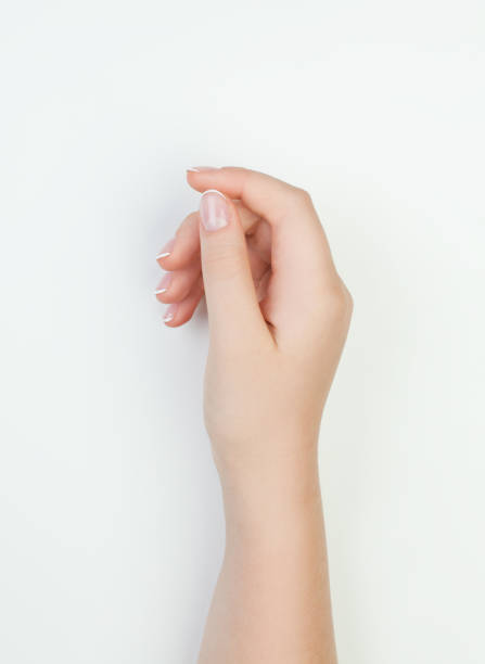 istock Beautiful female hand on white Manicure concept 1044185594
