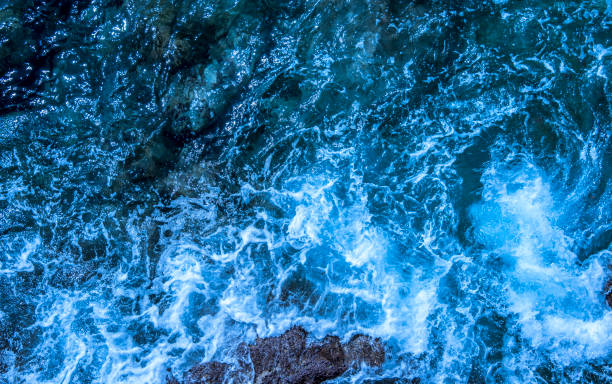 istock Blue deep sea foaming water background 1044185966
