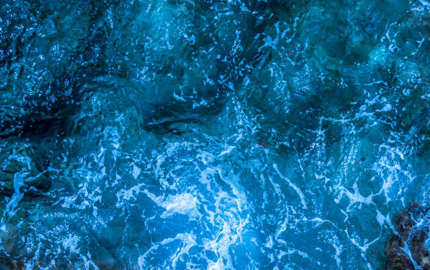 istock Blue deep sea foaming water background 1044188178