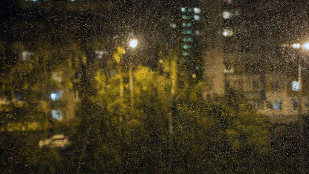 istock Raindrops on the window glass. The view from the window 1044188318