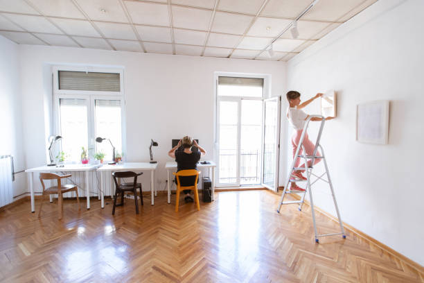 Two women arranging office hub