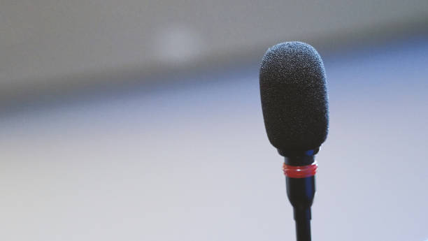 istock Mini microphone speaker in conference hall for speech in business seminar 1044189468