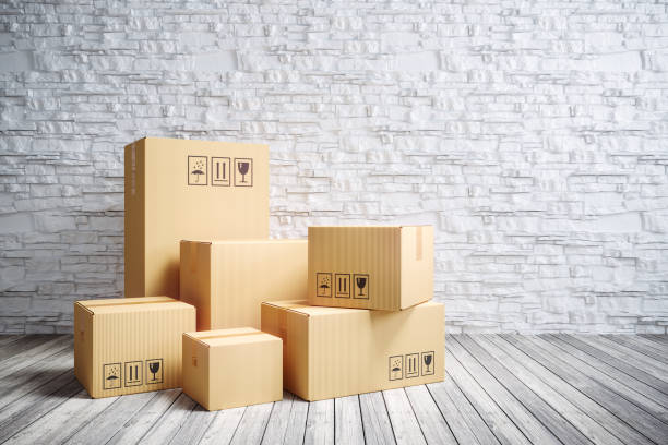istock Cardboard moving boxes in new home. 1044191802
