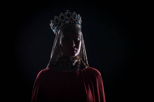 istock queen with crown, studio portrait on a black background 1044195998