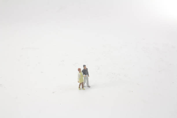 istock mini people Couple Lover standing on board 1044196850
