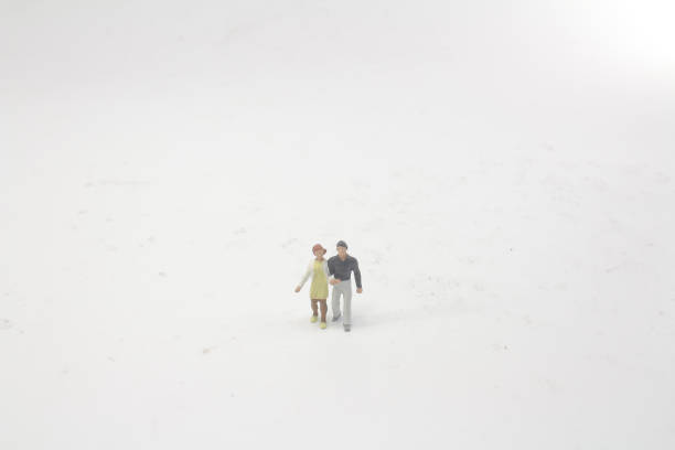 istock mini people Couple Lover standing on board 1044196970