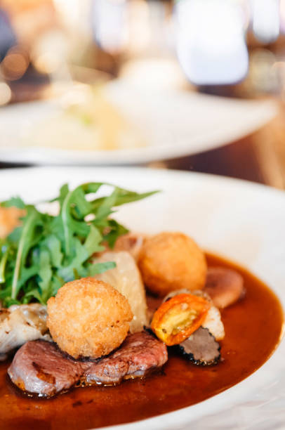 istock Sirloin beef steak with potato crogettes 1044197410