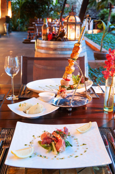 dinner table setting with barbecue and seafood