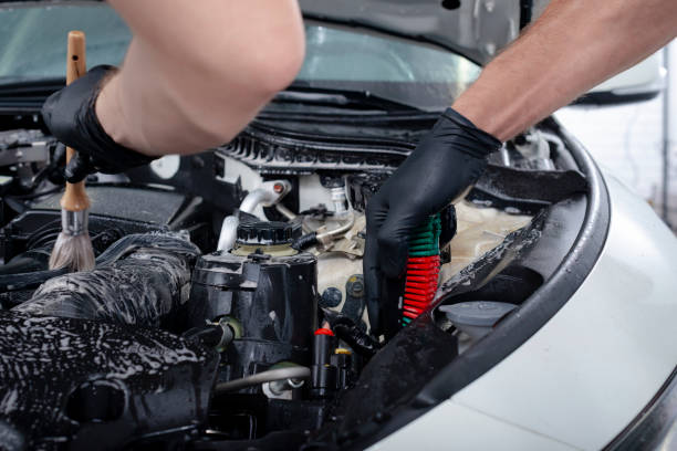 istock Cleaning engine with the foam and a brush 1044205620
