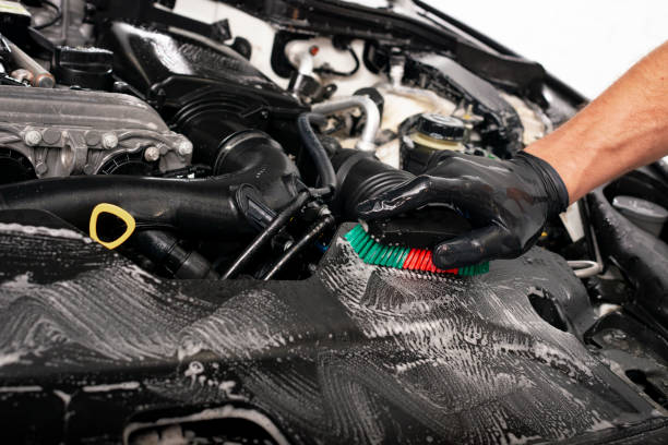 istock Cleaning engine with the foam and a brush 1044205908