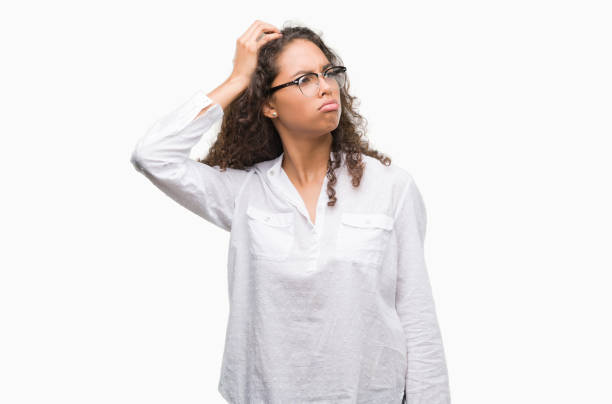 istock Beautiful young hispanic woman confuse and wonder about question. Uncertain with doubt, thinking with hand on head. Pensive concept. 1044206926