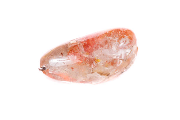 istock Macro mineral stone Rutile in quartz on a white background 1044206986
