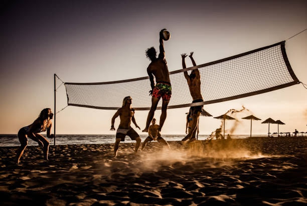 istock Playing volleyball on the beach at sunset! 1044210050