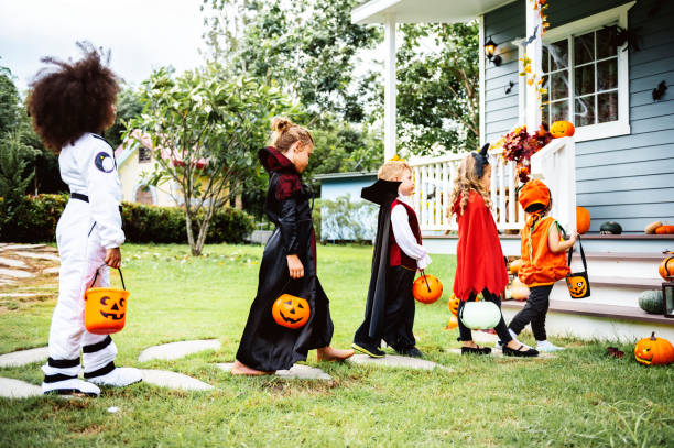istock Little children trick or treating 1044210072