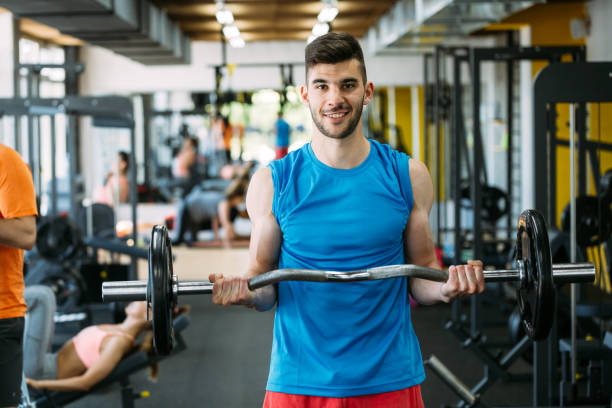 istock Determined male exercising in gym 1044210428