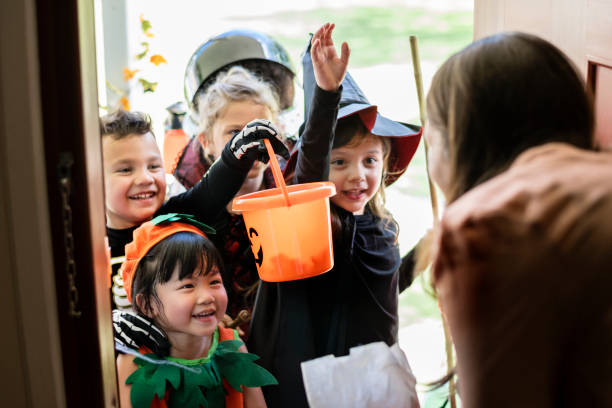 istock Little children trick or treating on Halloween 1044210460
