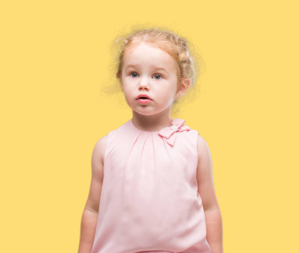 istock Beautiful blonde toddler gesturing 1044211078
