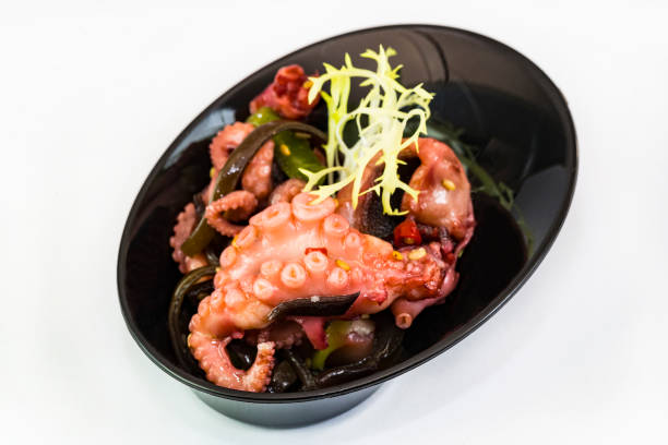 istock Mini canapes with seafood and vegetables and herbs and in plastic utensils 1044211188