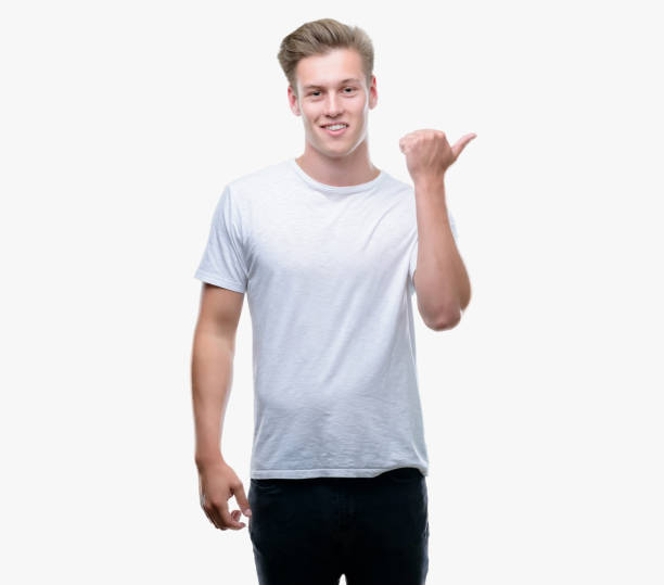 istock Young handsome blond man pointing with hand and finger up with happy face smiling 1044211486