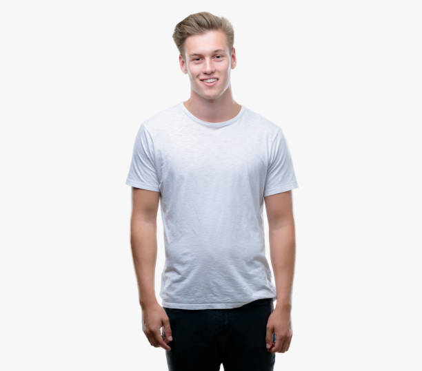 istock Young handsome blond man with a happy face standing and smiling with a confident smile showing teeth 1044211546