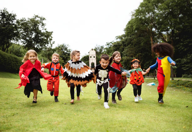 istock Little kids at a Halloween party 1044211550