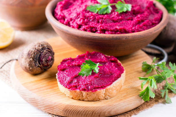 istock Roasted Beet Hummus with toast in a ceramic bowl 1044212754