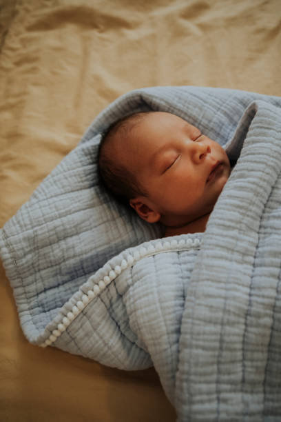 istock Infant baby fast asleep on the bed 1044216290