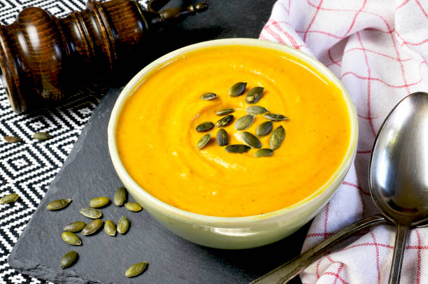 Hokkaido or butternut pumpkin soup with curry and seeds