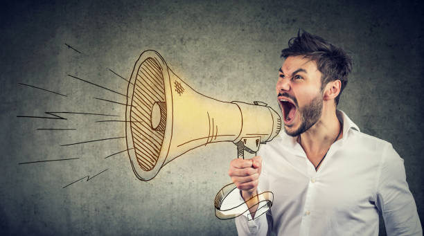 istock Man making announcement in the megaphone 1044217978