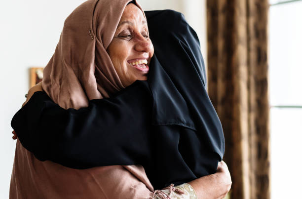 istock Muslim women hugging each other 1044218332