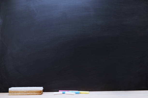 istock Blank Dark blackboard with color Chalk and eraser on the frame for drawing in Classroom. Horizontal composition. copy space empty Chalkboard Background. back to school. 1044222930