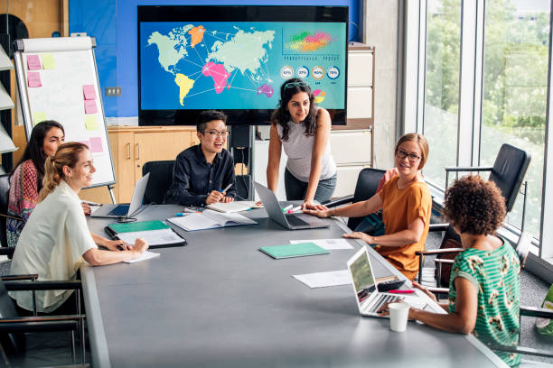 istock Mixed Ethnicity Women Only Group Discussing Strategy 1044228046