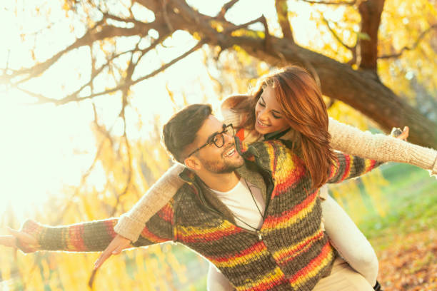 istock Autumn piggyback ride in the park 1044229656