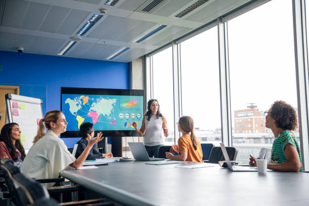 istock Standing to Speak in a Meeting 1044233374