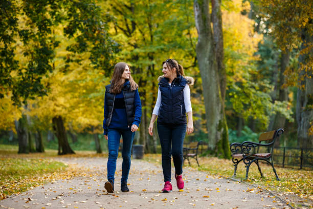 istock People walking in city park 1044234436