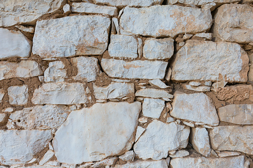 Old stone wall close-up background.