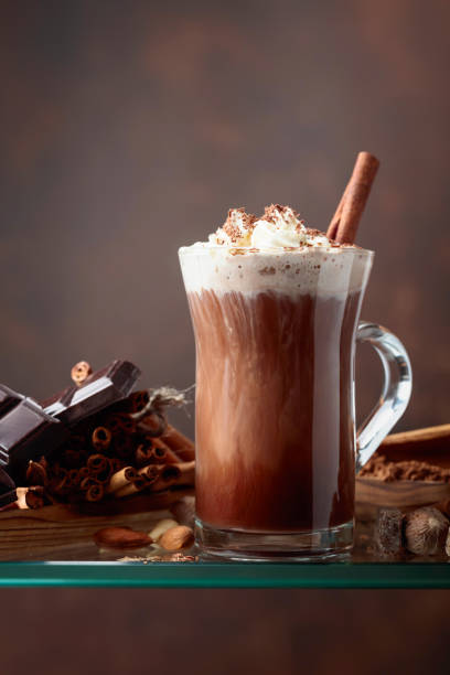 istock Cocoa with cream, cinnamon, chocolate pieces and various spices. 1044243138
