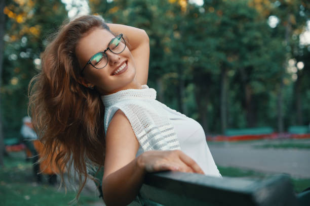 istock Positive woman having a break from city noise and work while bre 1044243524