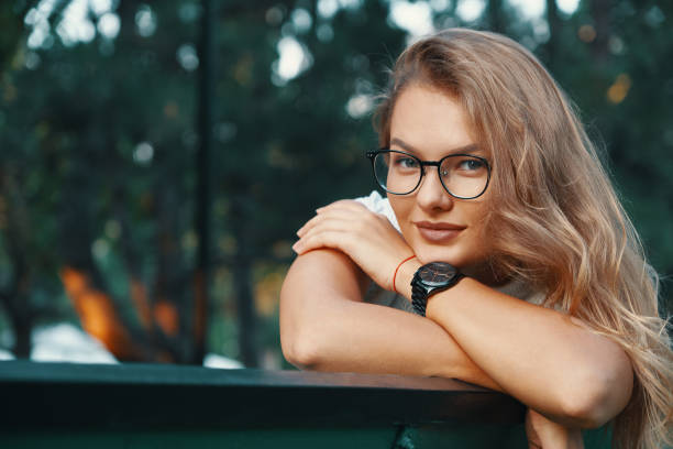 istock Positive woman having a break from city noise and work while bre 1044243526