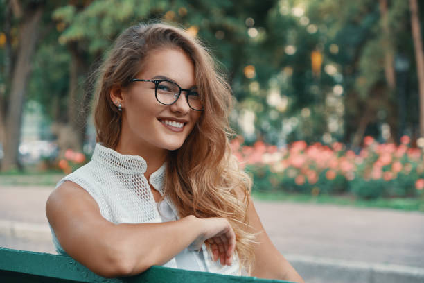 istock Positive woman having a break from city noise and work while bre 1044243542