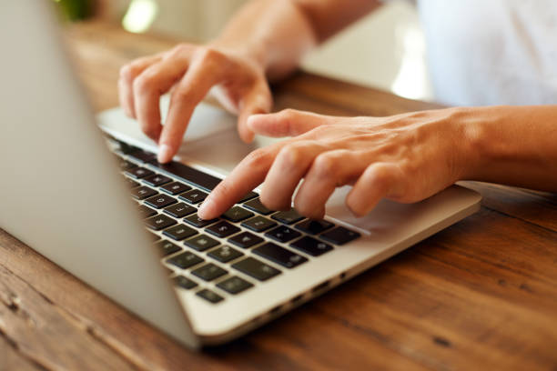 istock Woman working on a computer at home 1044249742