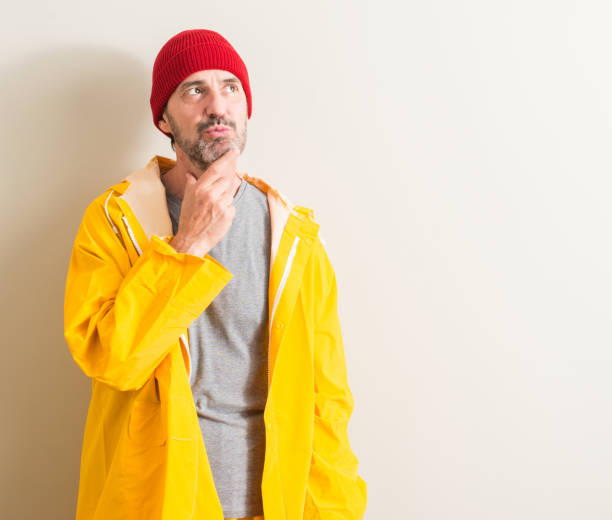 istock Senior fisherman serious face thinking about question, very confused idea 1044252216